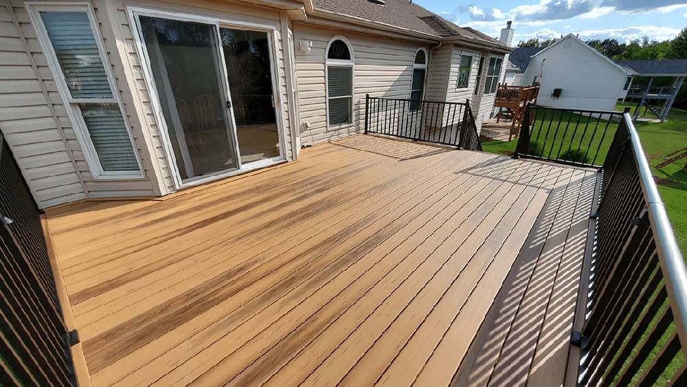 A beautiful new deck with a sliding kitchen door.