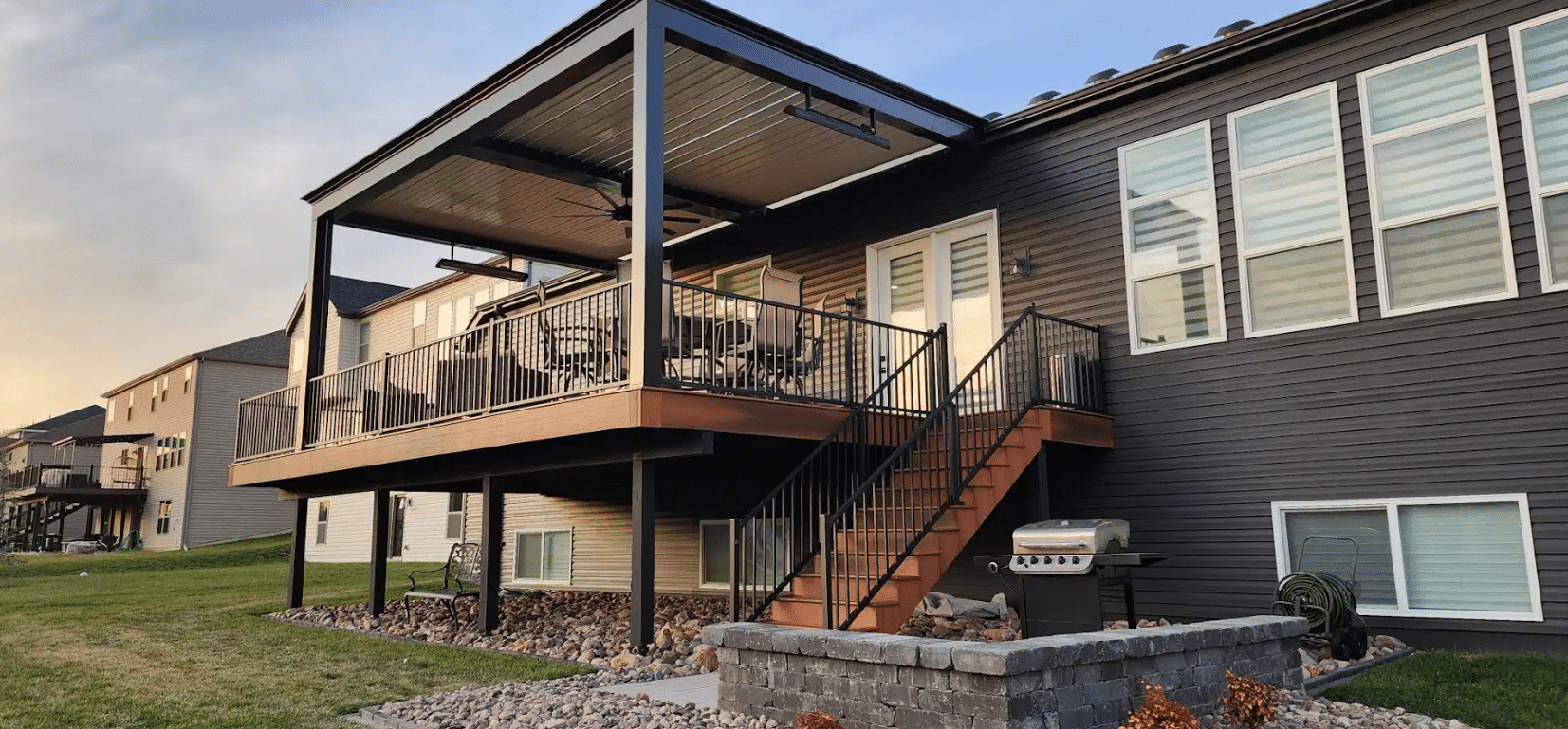 raised deck with deck railing and deck steps with a louvered roof pergola - Custom Deck Contractor - Deck Features and add-ons for your deck in st louis missouri