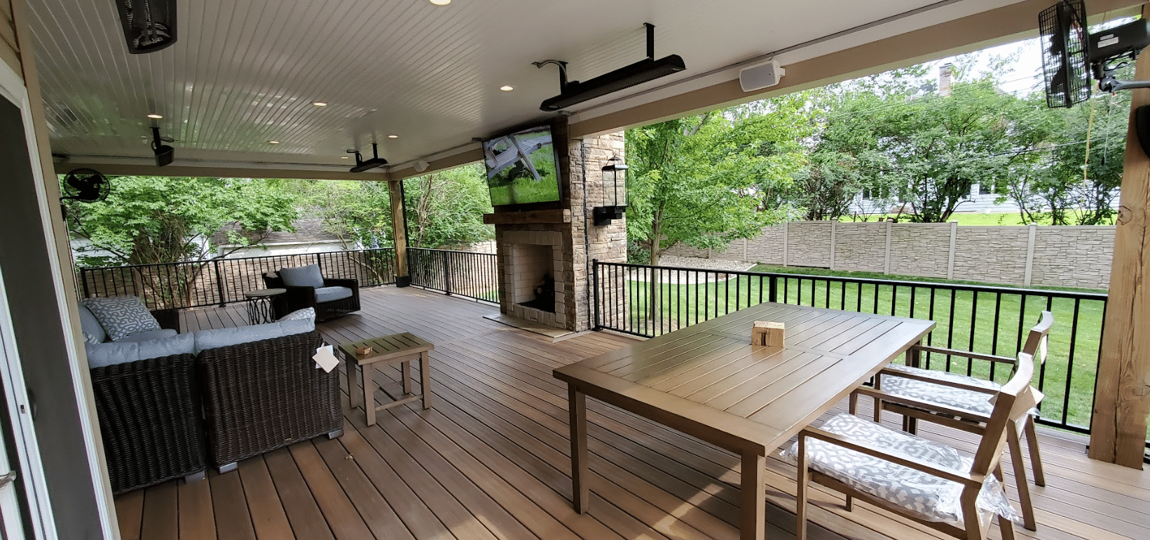 covered deck with finished ceiling, composite deck boards, and outdoor furniture - Composite Deck installation near me in St Louis Missouri